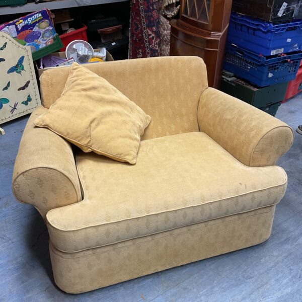 Yellow vintage Marks and Spencer cuddle chair with cushions.