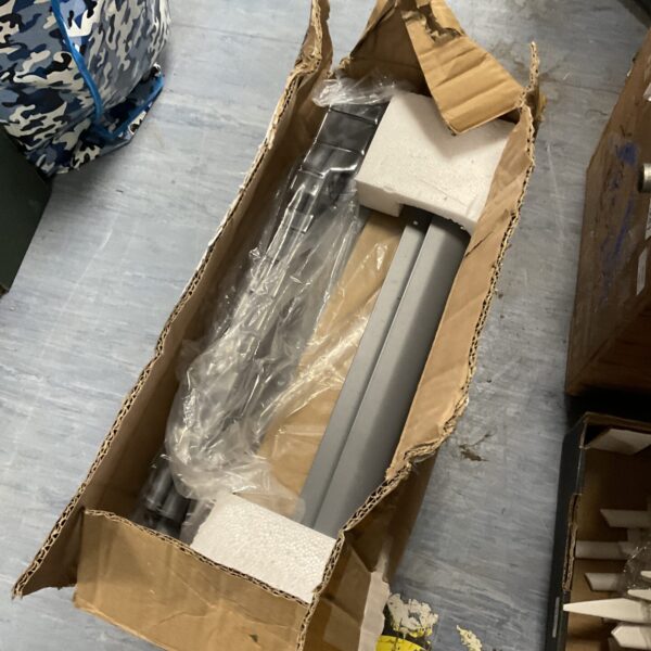 New metal shelf unit still sealed in its original cardboard box.