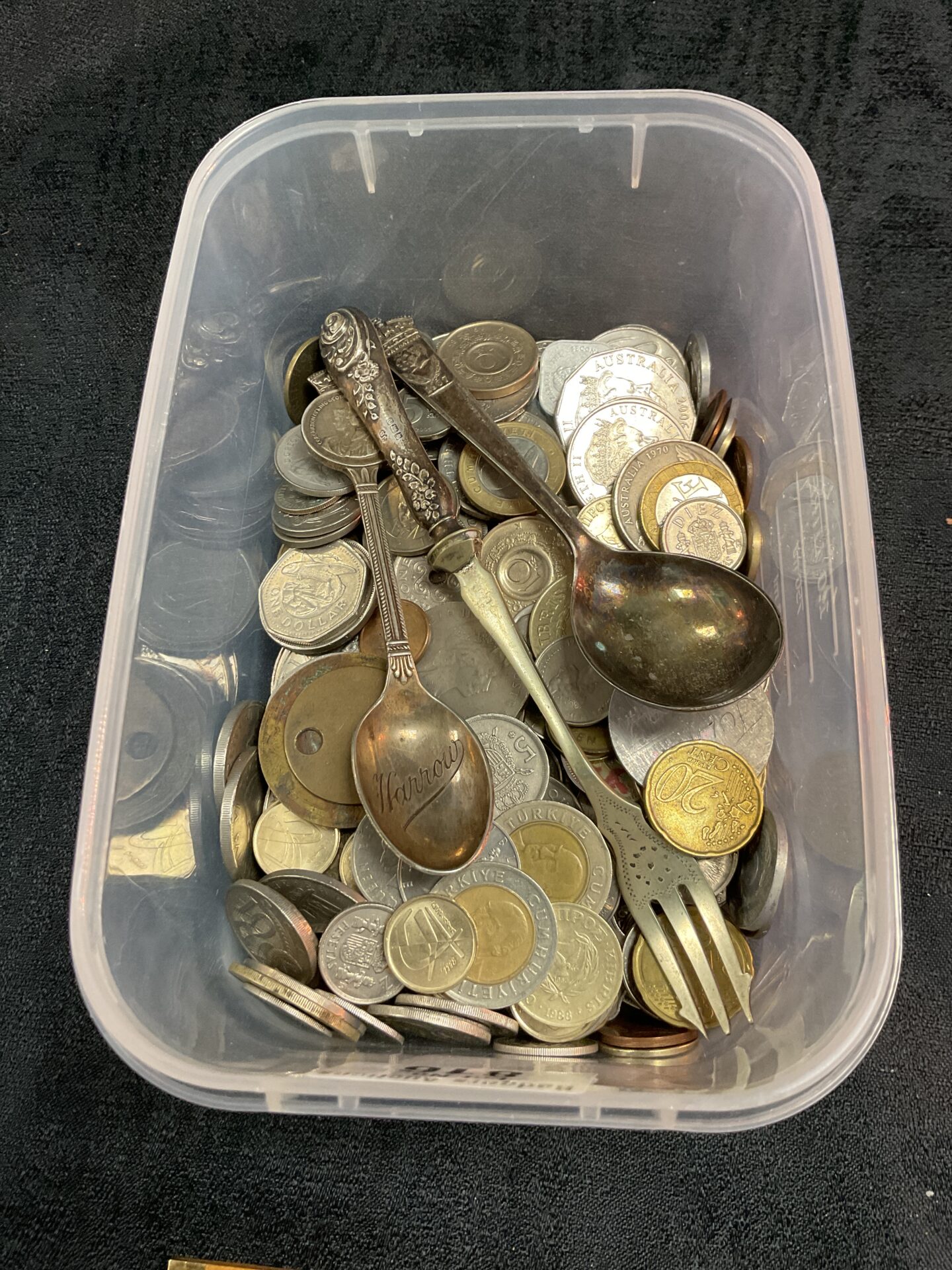 816 Tub of mixed coins and three spoons