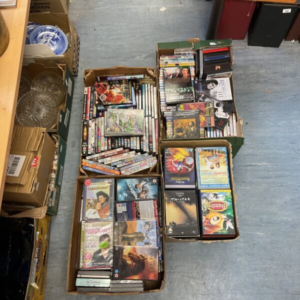 Four boxes filled with a mixed DVD lot for collectors.