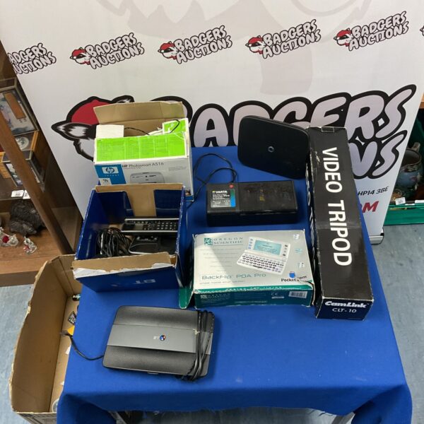 Mixed lot of vintage phones, routers, and a Backflip PDA Pro.