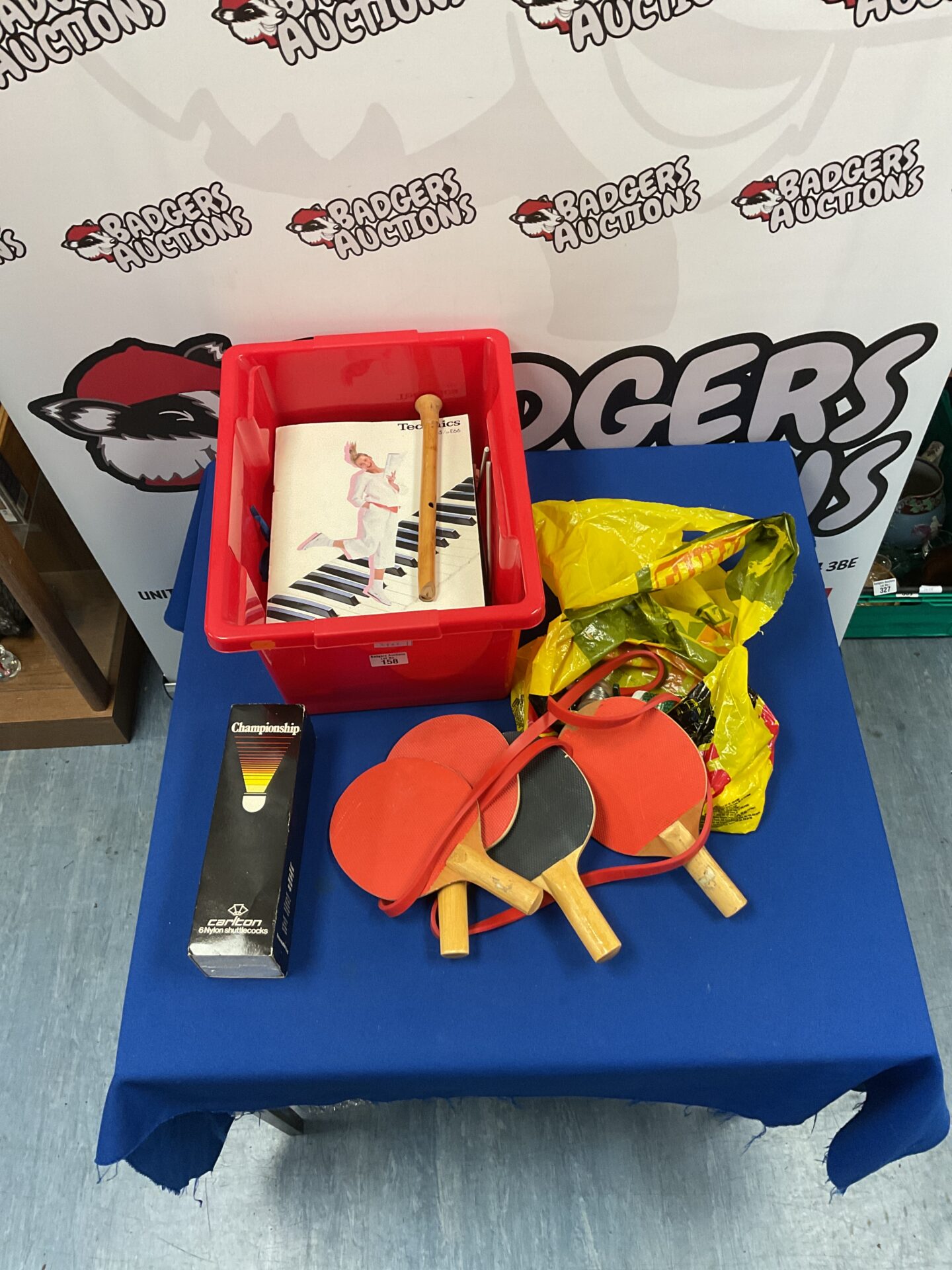 158 Mixed box with ping pong racquets, shuttle cocks, and sheet music