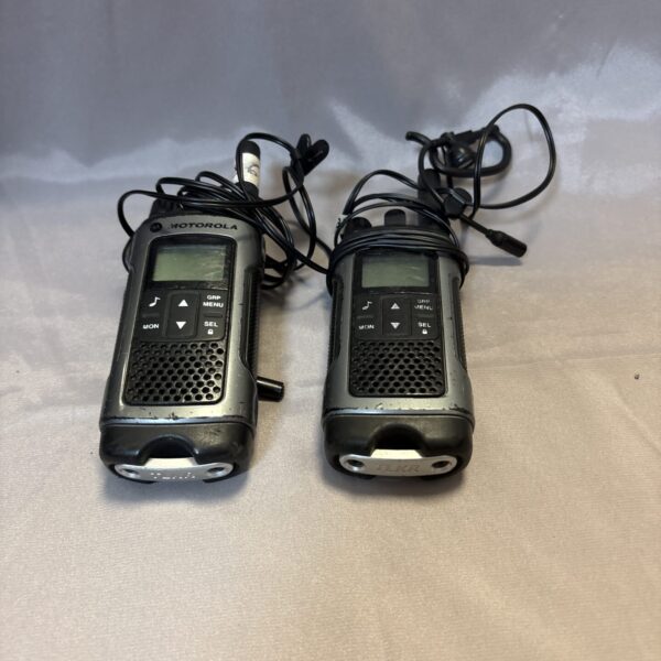Pair of vintage Motorola walkie talkies in used condition.