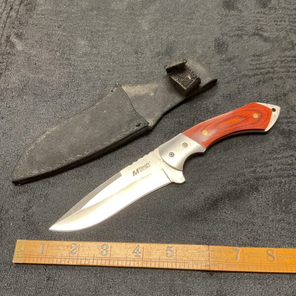 Mtech USA sheath knife with wood grain handle and black sheath.