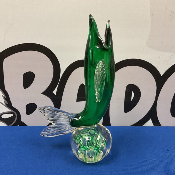 Vibrant green Murano glass dolphin sculpture on a clear base.