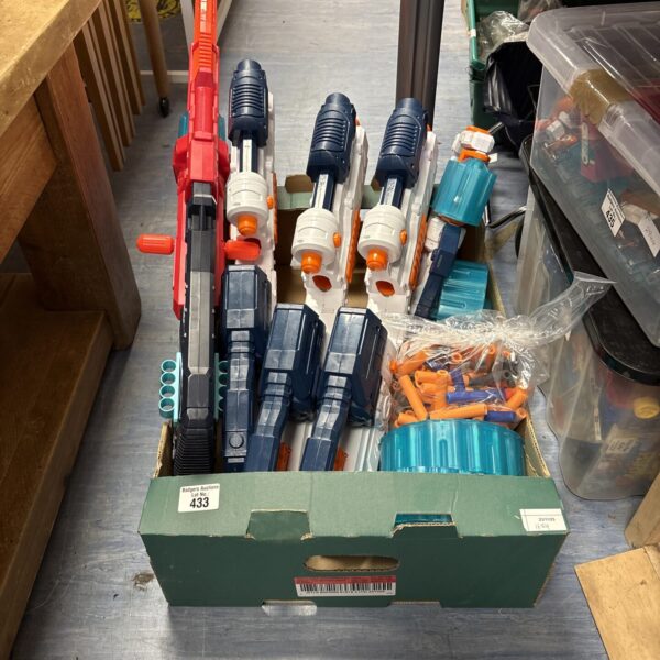 A lot of pre-owned Nerf guns and a bag of darts for active play.