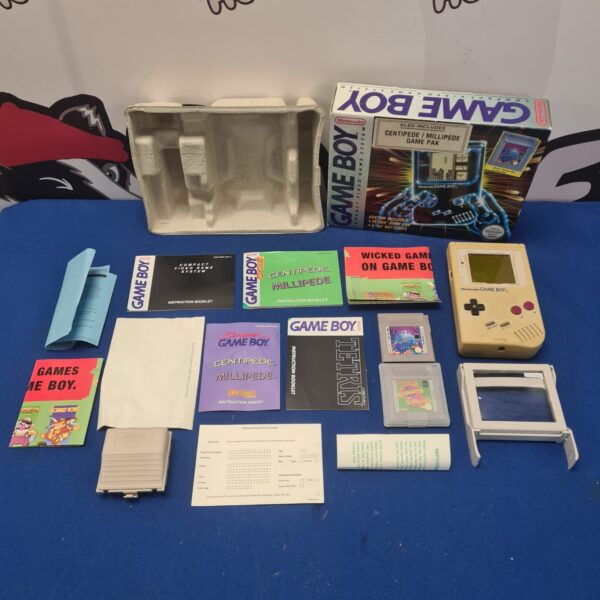 Boxed Nintendo Game Boy with games and accessories.
