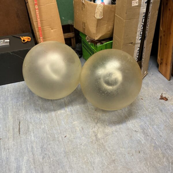 Vintage orbital outside lamps with a mid-century modern design.