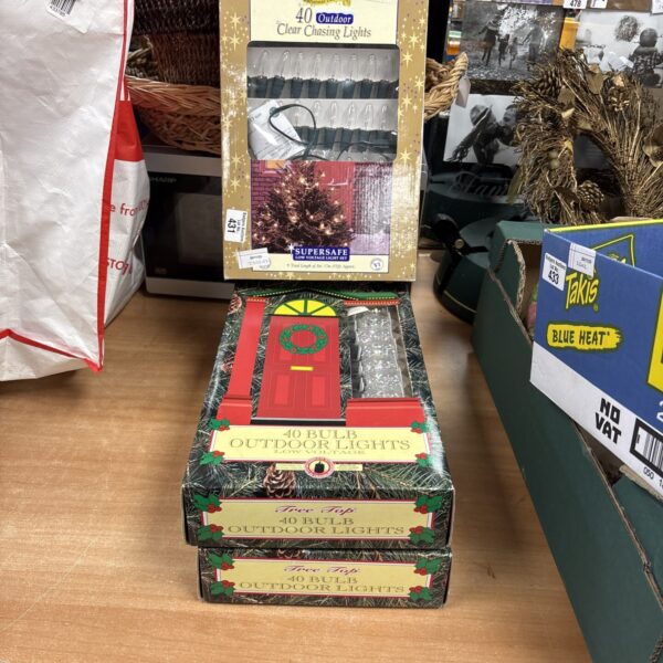 Three boxes of 40 outdoor Christmas lights for festive decoration.