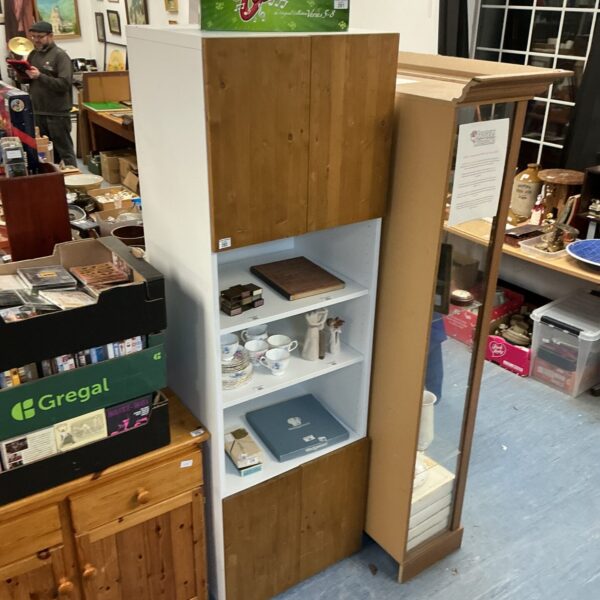 Vintage pine cupboard and shelf unit for storage and display.