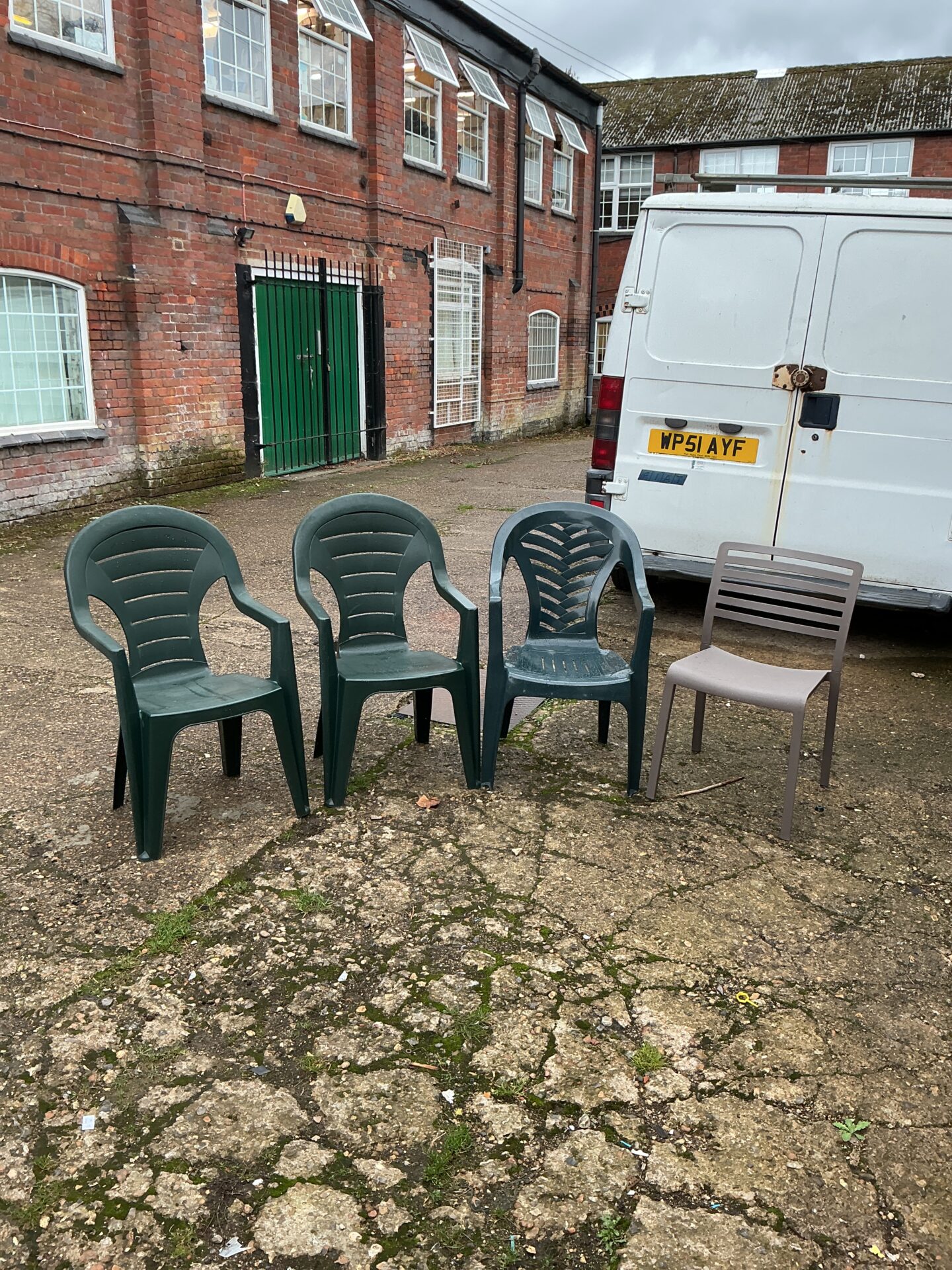1199 Four plastic garden chairs