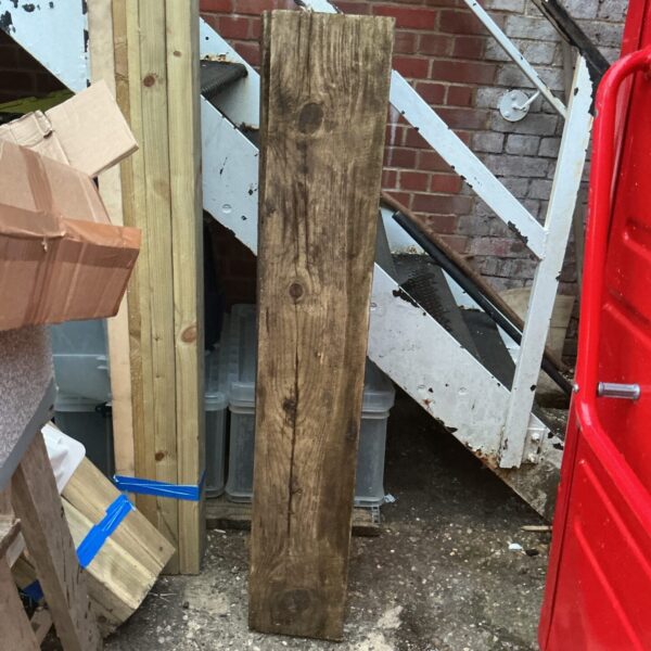 Weathered reclaimed oak beam for rustic projects.