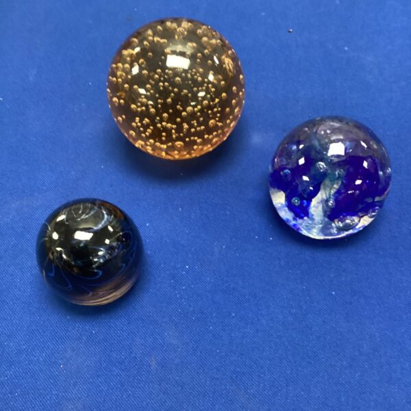 Signed glass paperweights by S. Langley, collectible art glass.