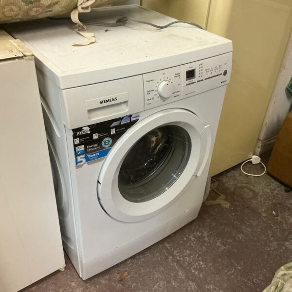 White Siemens iq300 washing machine front view.