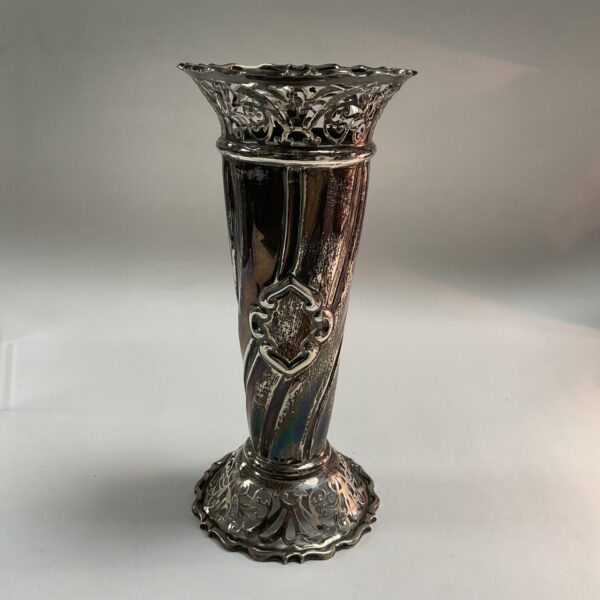 Antique silver Art Nouveau vase with intricate detailing.