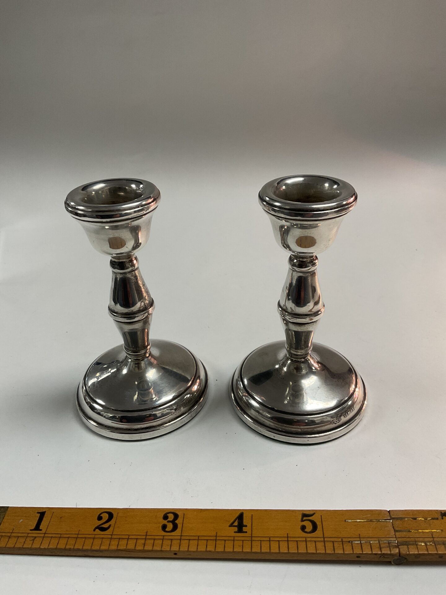 1040 pair of Birmingham hallmarked sterling silver candle sticks