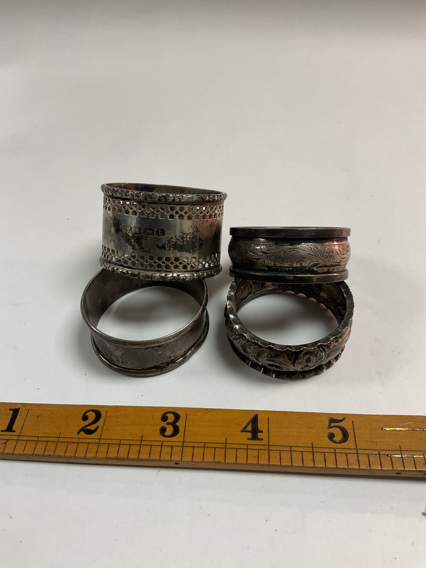 1038 Four Hallmarked silver Napkin rings 52.9g
