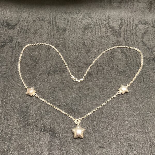 Delicate 925 silver star pendant on a 28 inch necklace.