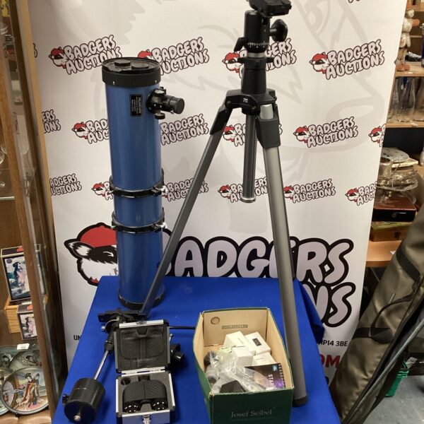 Sky-Watcher telescope with Titan CT300 tripod and accessories displayed.