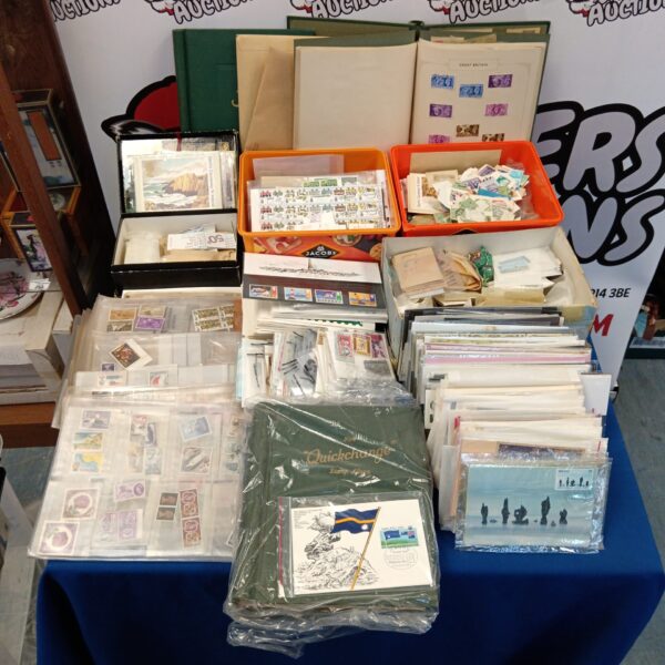 Large stamp collection with albums and boxes of vintage stamps.