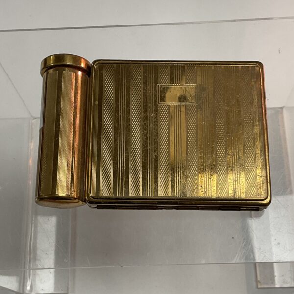 Vintage gold Stratton compact mirror with art deco design.