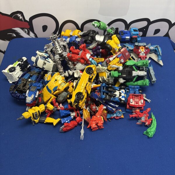 A colourful lot of vintage Transformer toys and action figures.