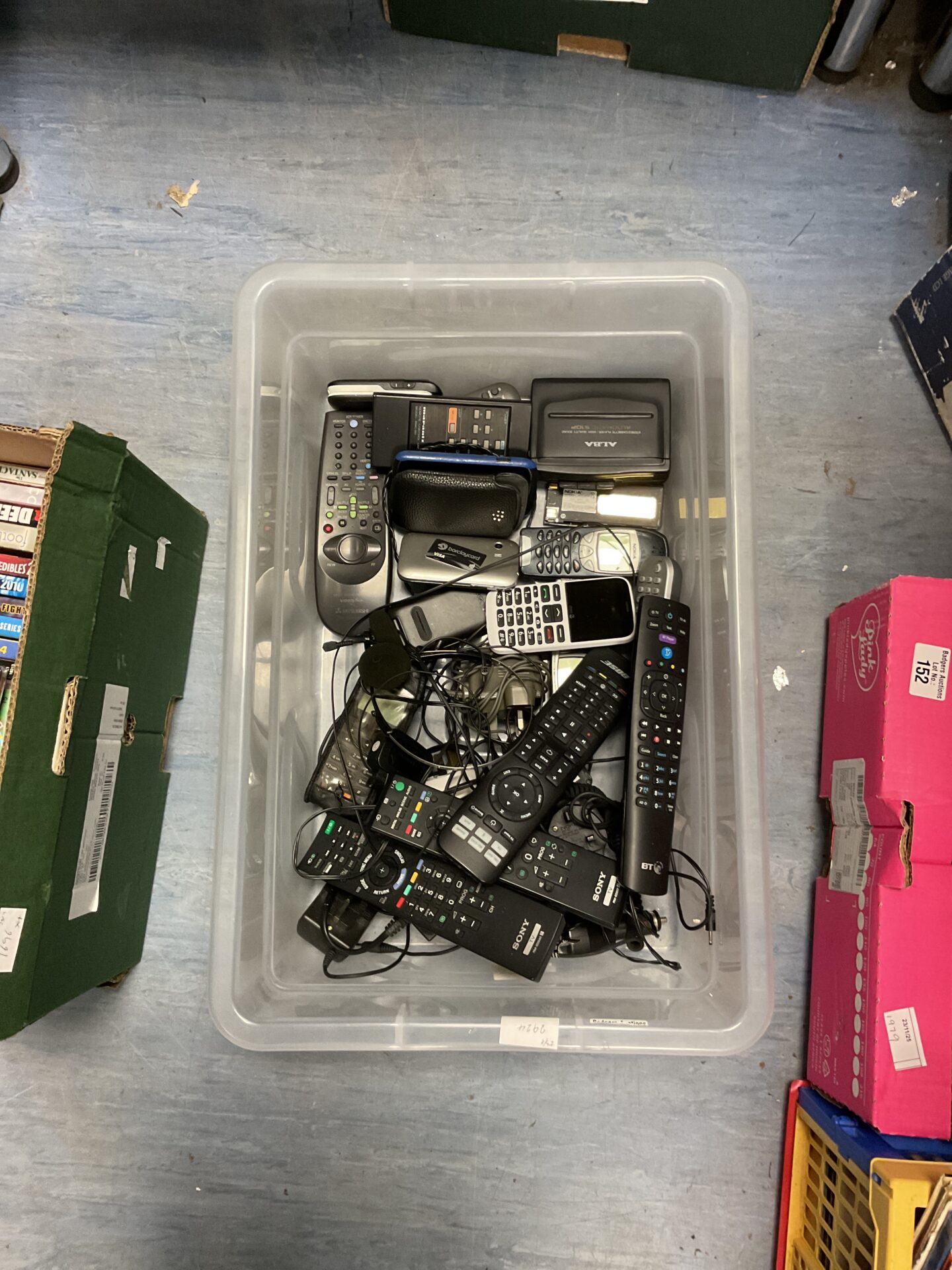 116 Box of mixed TV remotes and phones incl. Nokia, Samsung, Motorola