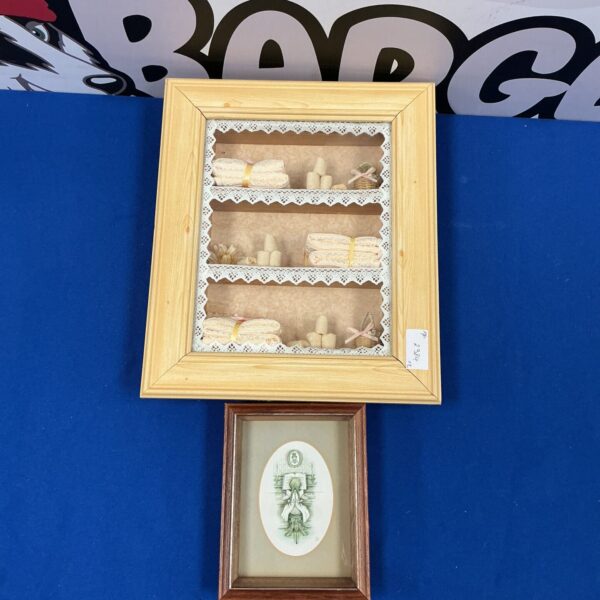 Vintage bathroom diorama with a miniature piano player in a framed scene.