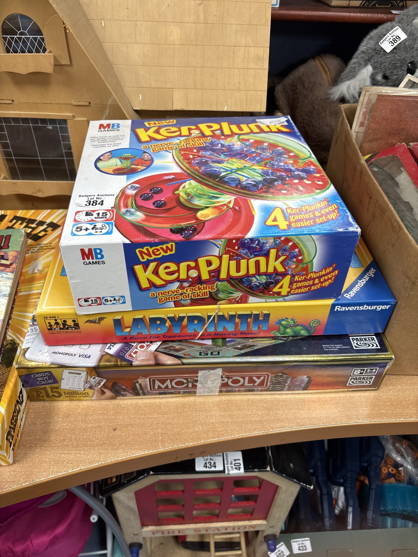 384 Three games including kerplunk and monopoly