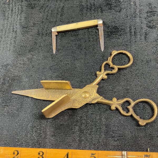 Antique brass wick trimmer for oil lamps and candles, vintage collectible.