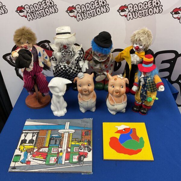 Vintage clown and piggy bank collection, colourful character figurines.