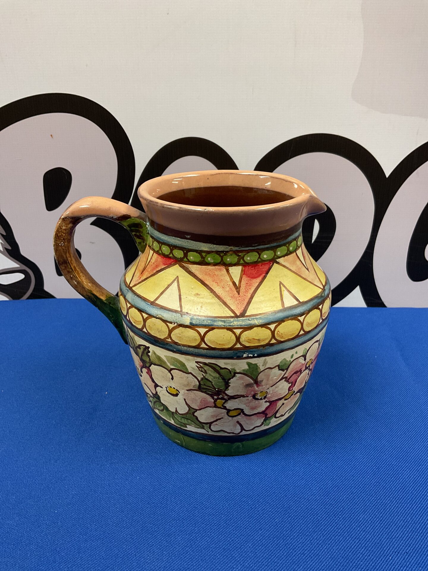 031 A robb 1956 signed hand painted floral patterned jug
