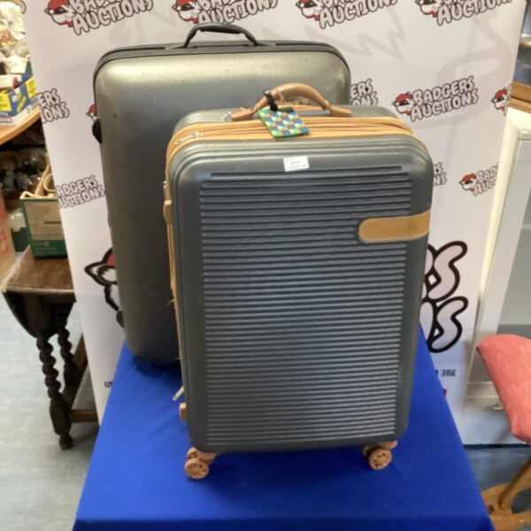 Large vintage hard shell suitcase, ideal for travel or collection.