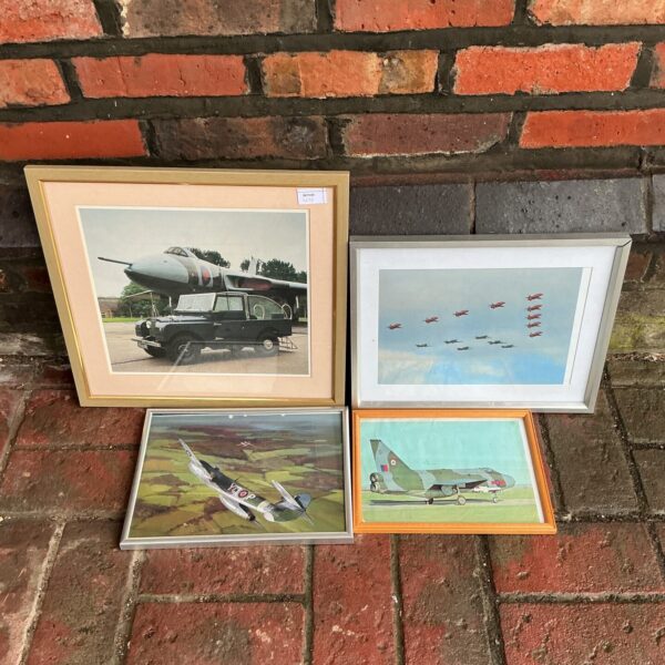Vintage military print of an aircraft in a framed display.