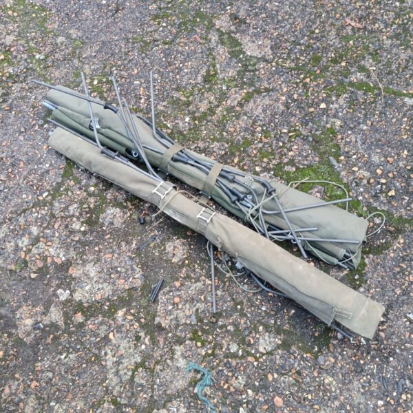 Two vintage military camp beds in used condition.