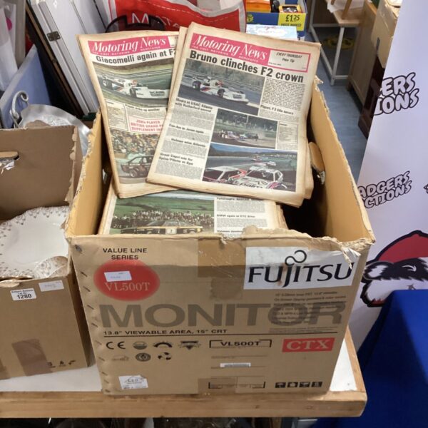 Large lot of vintage *Motoring News* newspapers for collectors.