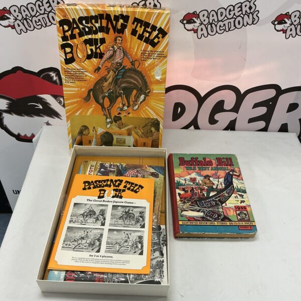 Vintage Passing the Buck game and Buffalo Bill Annual, collectible toy.