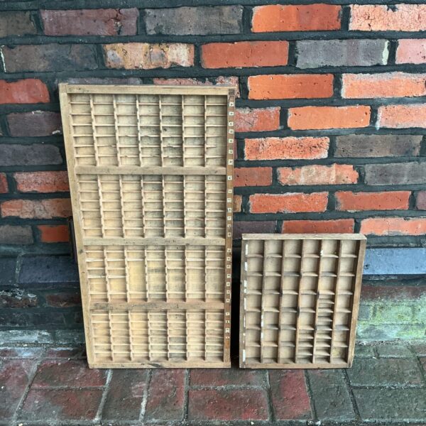 Vintage wooden printers block trays for letterpress printing.