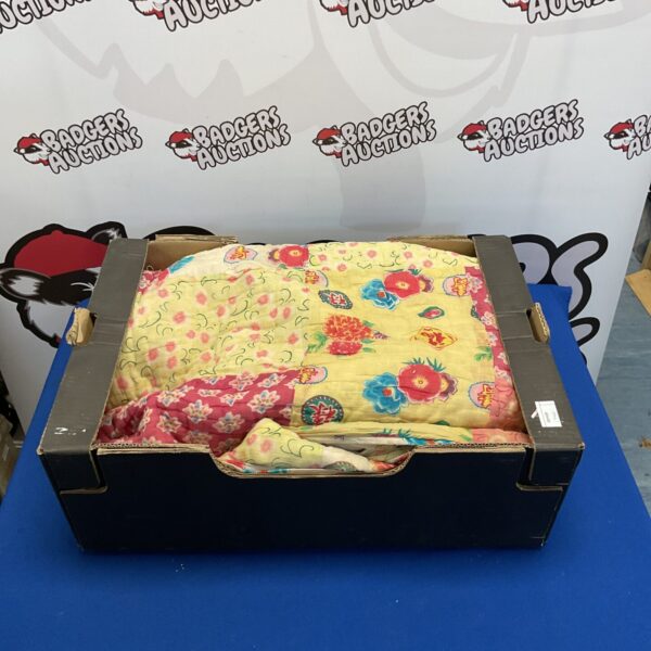 Vintage oriental silk quilt with vibrant floral patterns.