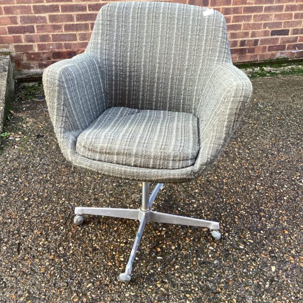 Grey vintage swivel office chair with textured fabric.