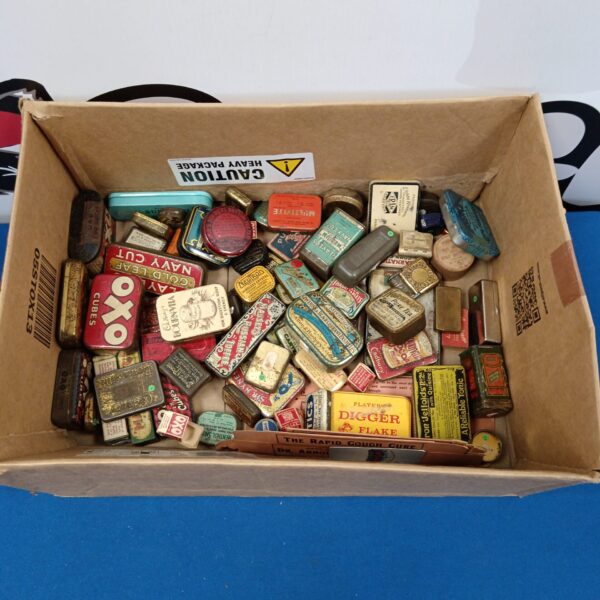 Vintage tin collection featuring Oxo, Players and Cadbury brands.