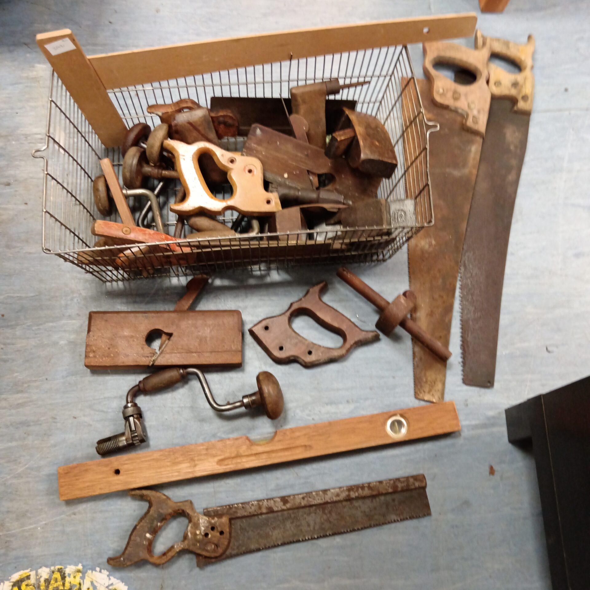 1221 Basket full of vintage wood working tools Inc planes & saws