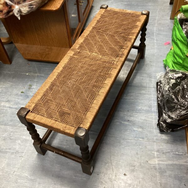 Vintage woven footstool with oak frame and rush seat.