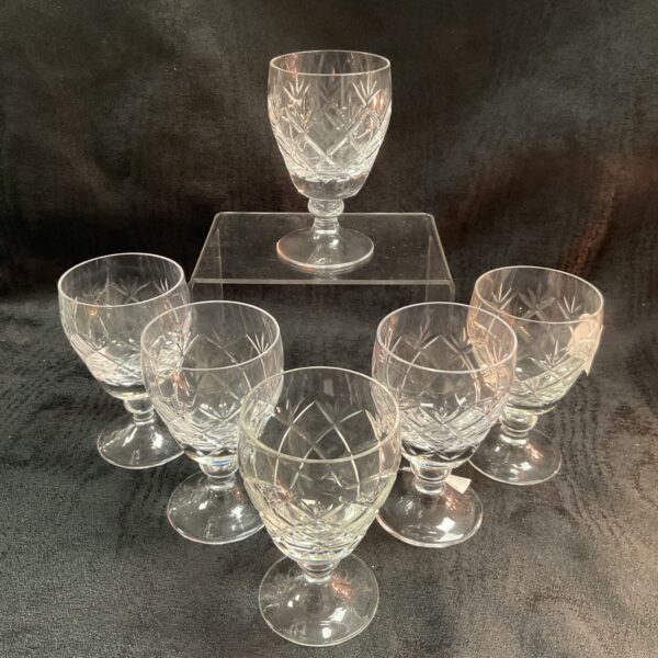 Six vintage Whitefriars crystal wine glasses with garland pattern.