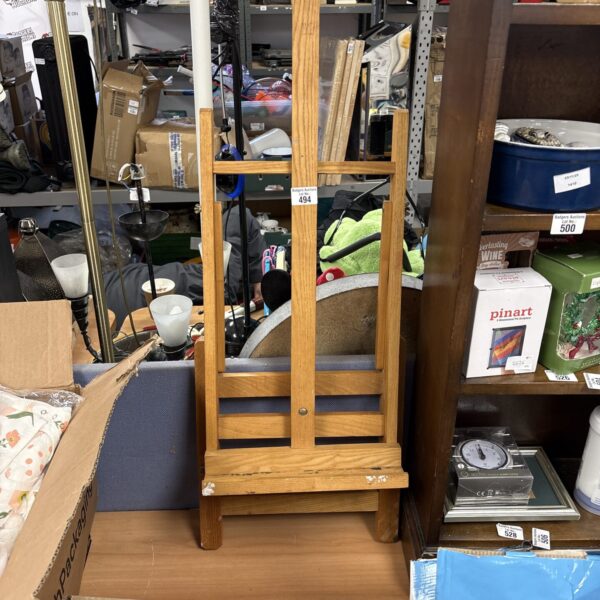 Small wooden artist easel for tabletop painting and display.