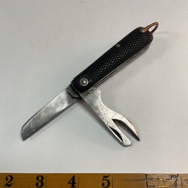 Open WW2 British Army jack knife showing blade and fork.