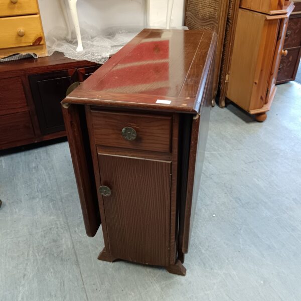 Vintage 1950s oak dropleaf table with drawer and cupboard.