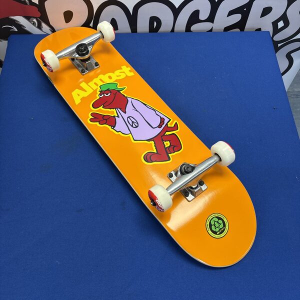 Almost skateboard with Tensor trucks and vibrant graphic design.