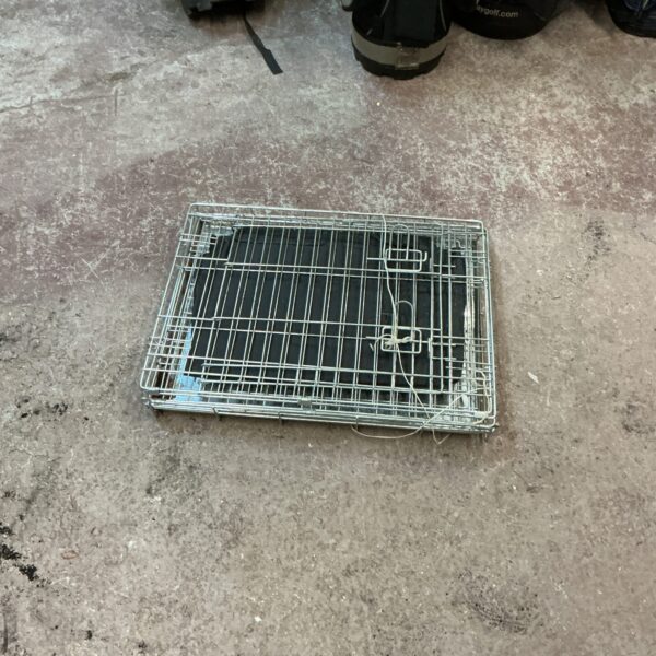 Wire animal transfer crate for small pets and animals.