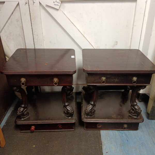 Pair of antique mahogany bedside cabinets with lion head handles.